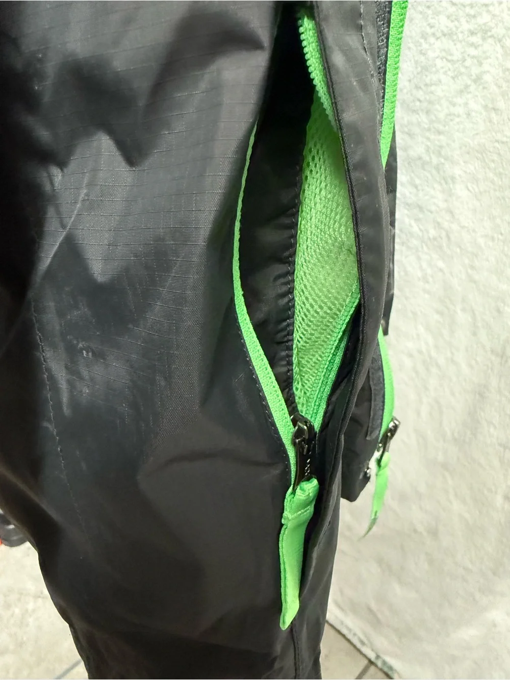 The North Face Kids Black Raincoat with Neon Green Lining